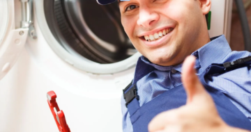 Appliance repair technician inspecting a home appliance in Lincoln, NE.